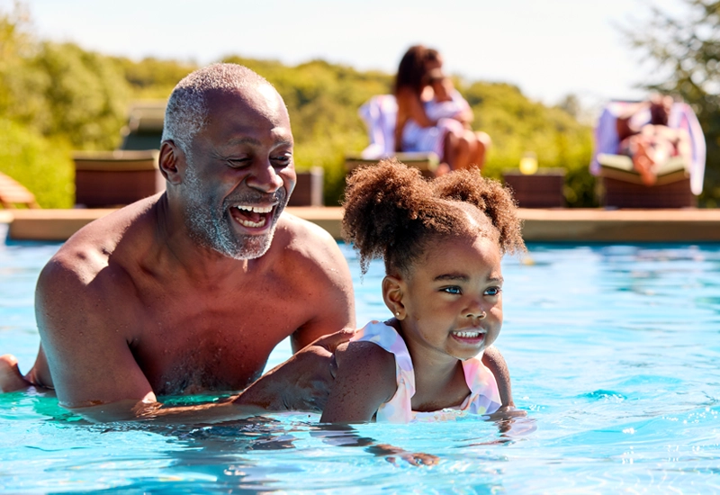grandfather-enjoying-pool-with-family
