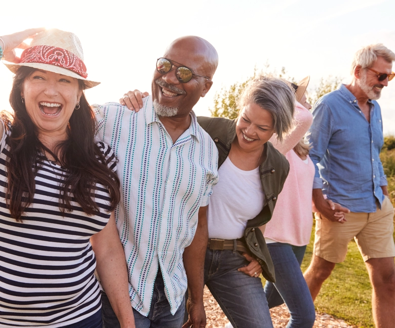 active-group-walking-outside-sun